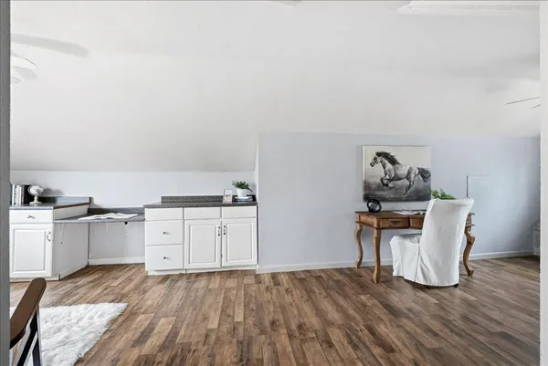 a room with furniture and wooden floor