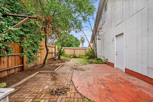 a sidewalk with a trees in front of it