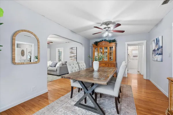 a view of a dining room with furniture window and wooden floor