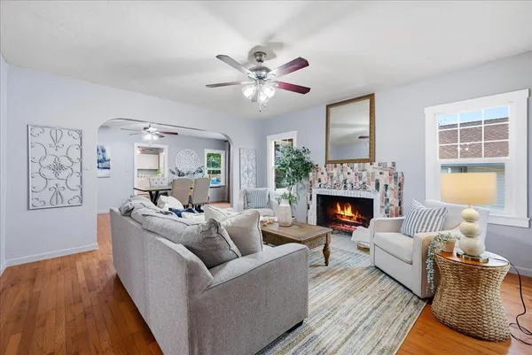 a living room with furniture and a fireplace