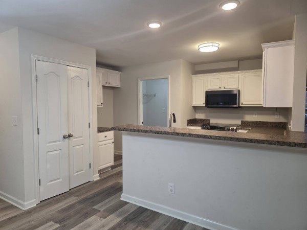 1556 Tylertown Road Clarksville, TN 37040 - Photo 8 of 10 a kitchen with stainless steel appliances granite countertop a refrigerator and a stove top oven
