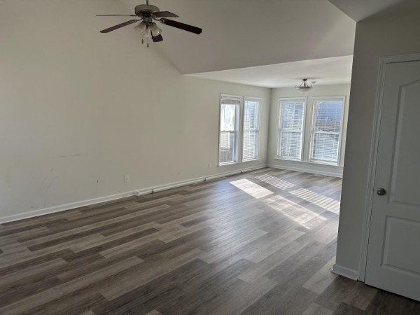 1556 Tylertown Road Clarksville, TN 37040 - Photo 9 of 10 wooden floor in an empty room with a window