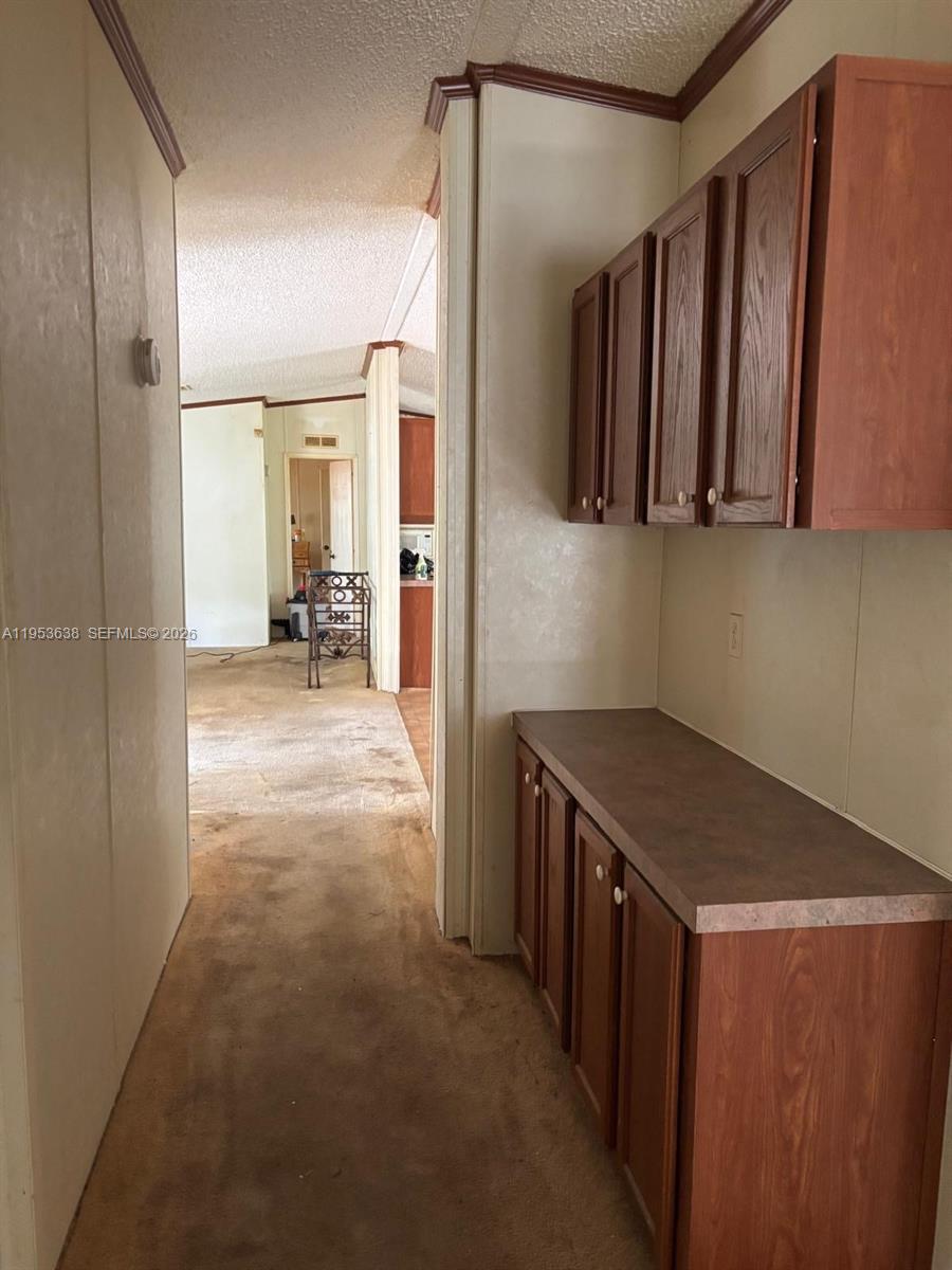 1980 Al Don Farming Road Clewiston, FL 33440 - Photo 13 of 26 a kitchen with a stove and a refrigerator