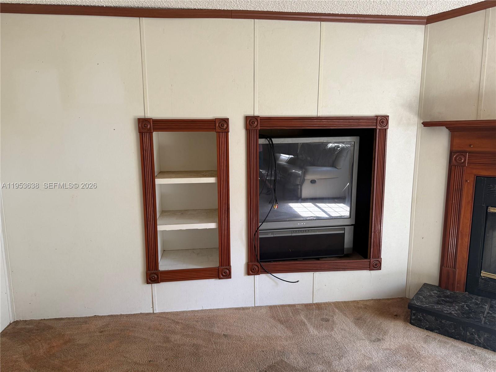 1980 Al Don Farming Road Clewiston, FL 33440 - Photo 17 of 26 a living room with a fireplace