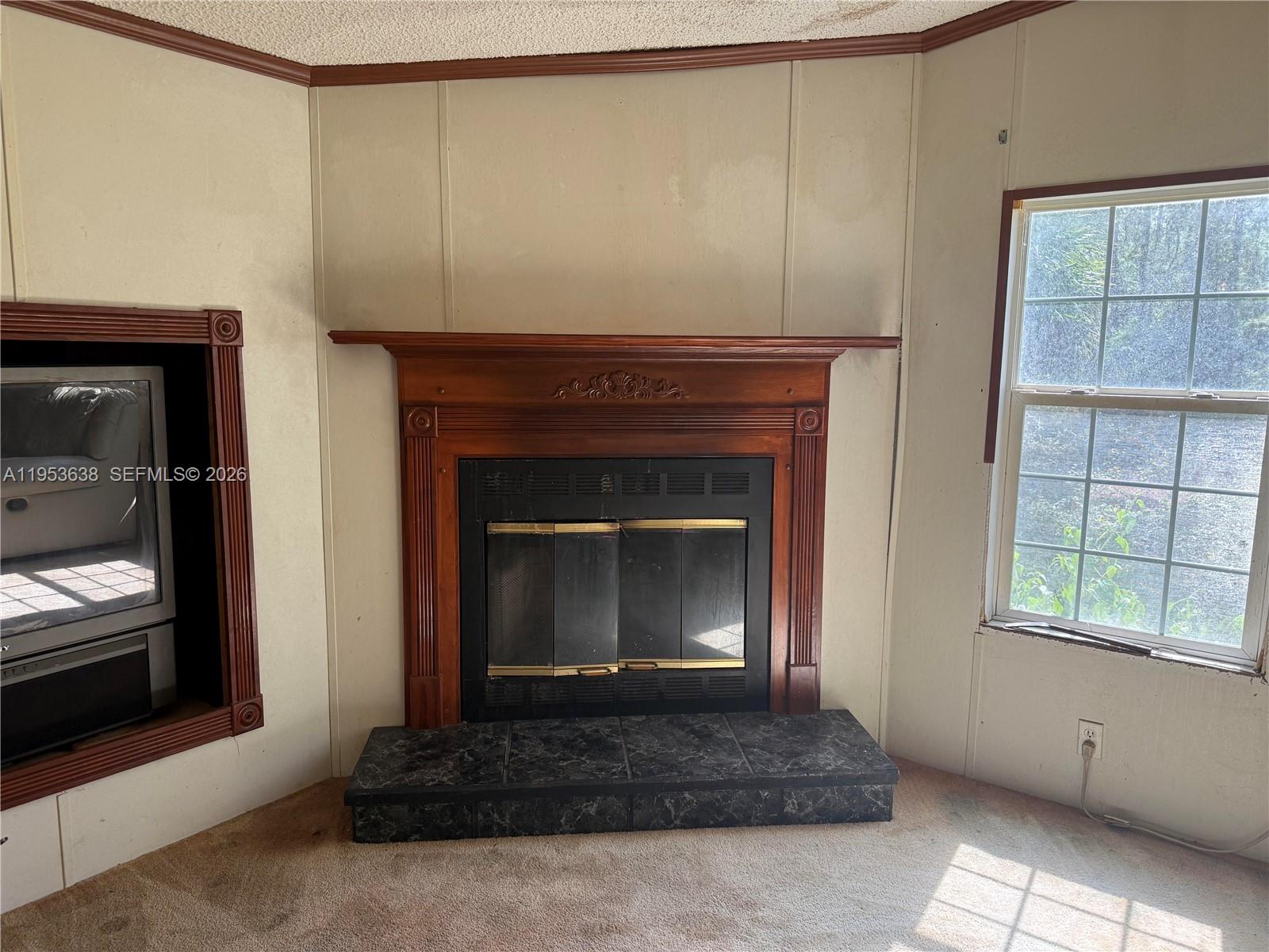 1980 Al Don Farming Road Clewiston, FL 33440 - Photo 21 of 26 a living room with a fireplace