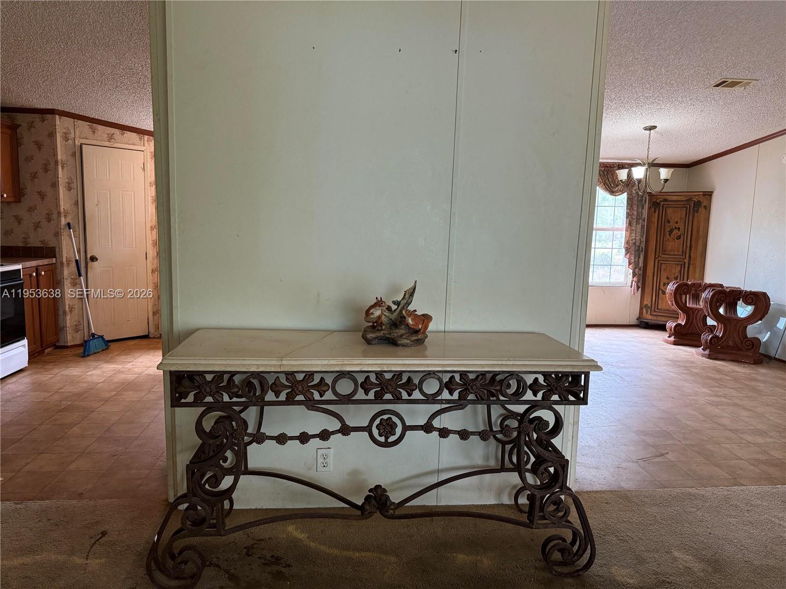 1980 Al Don Farming Road Clewiston, FL 33440 - Photo 10 of 26 a living room with a table and a couch