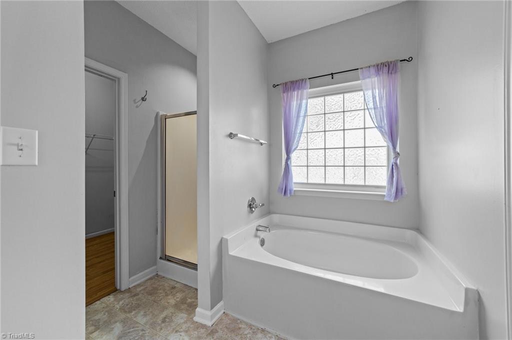 4712 Ridgefall Road Greensboro, NC 27410 - Photo 16 of 44 View of the bathtub on the primary bath.