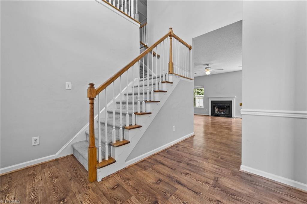 4712 Ridgefall Road Greensboro, NC 27410 - Photo 20 of 44 View of foyer with stairs going to second floor.