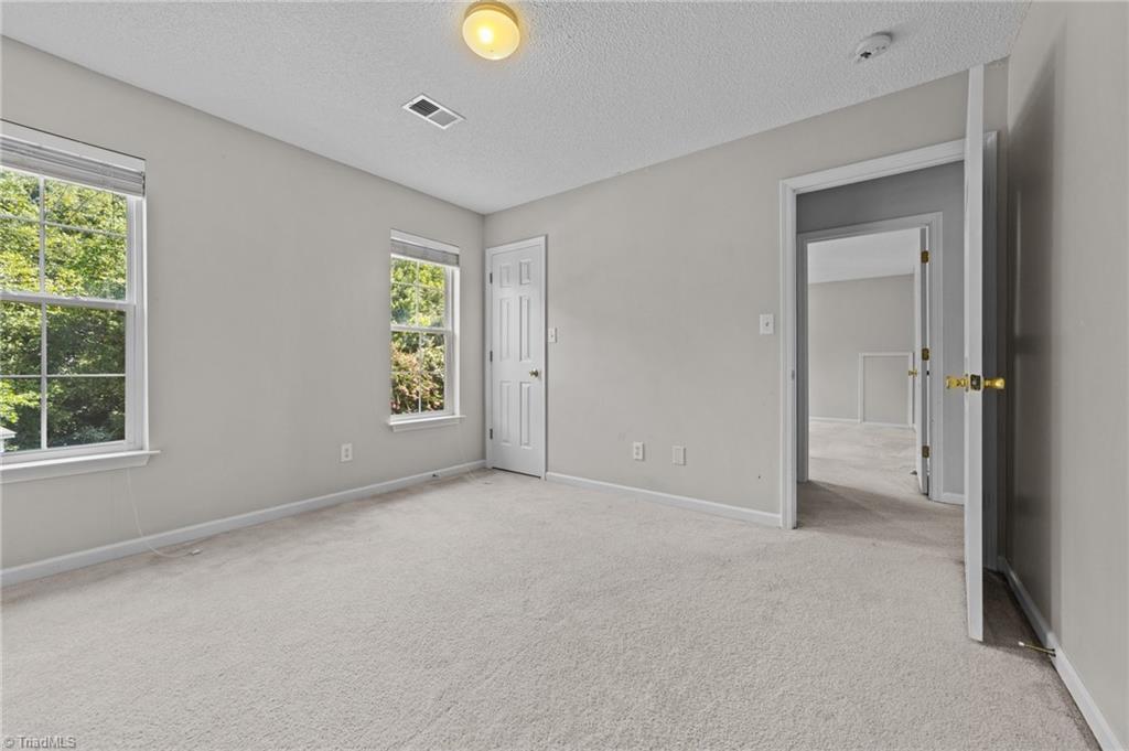 4712 Ridgefall Road Greensboro, NC 27410 - Photo 28 of 44 Another view of the 4th bedroom with closet.
