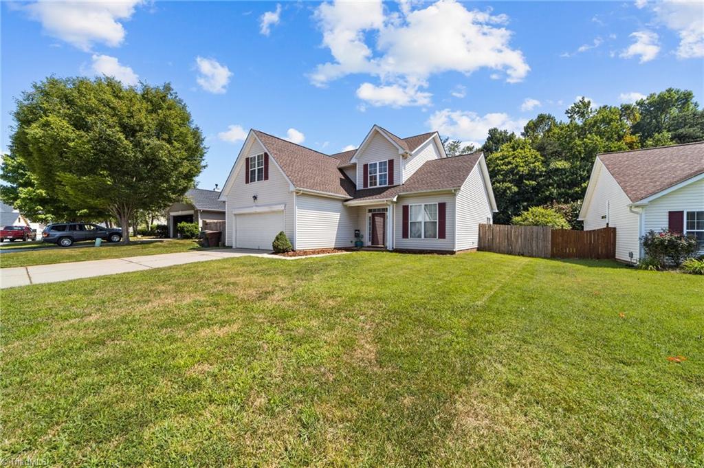 4712 Ridgefall Road Greensboro, NC 27410 - Photo 34 of 44 Front view showing garage and entrance.