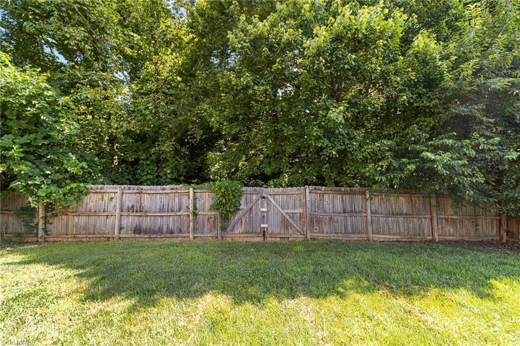 4712 Ridgefall Road Greensboro, NC 27410 - Photo 39 of 44 Backyard with fences.