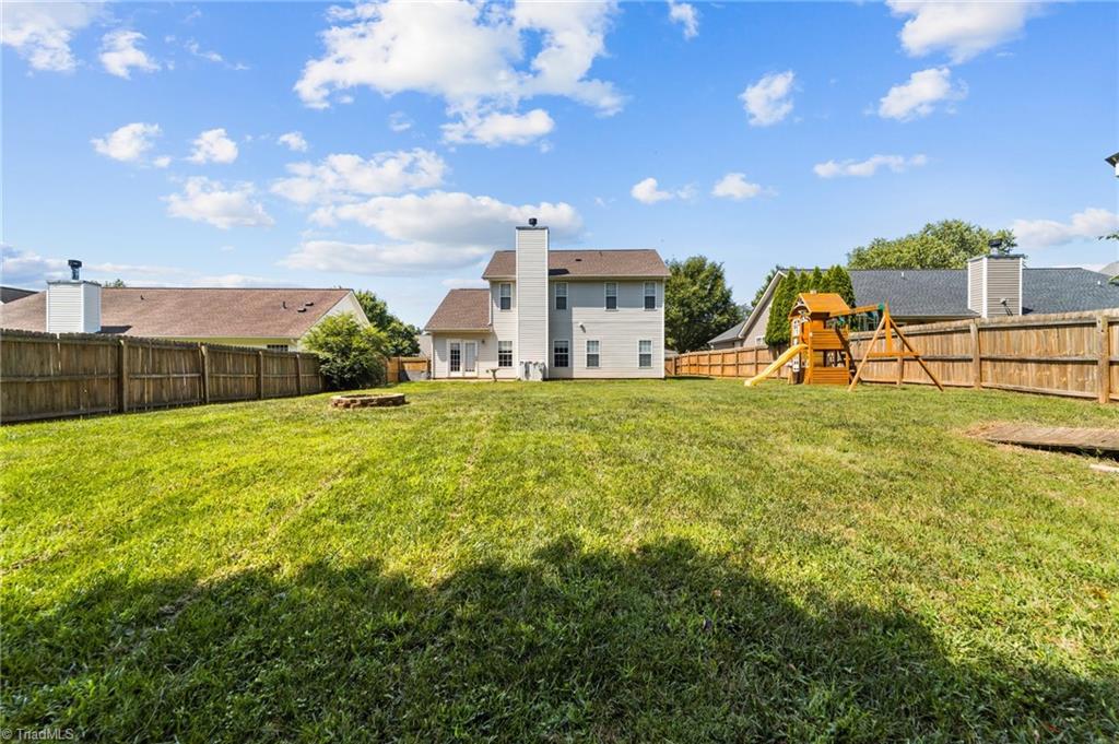 4712 Ridgefall Road Greensboro, NC 27410 - Photo 40 of 44 View of the house from the outmost fence.