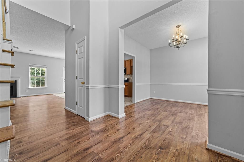 4712 Ridgefall Road Greensboro, NC 27410 - Photo 8 of 44 View of foyer and access to dining room living room.
