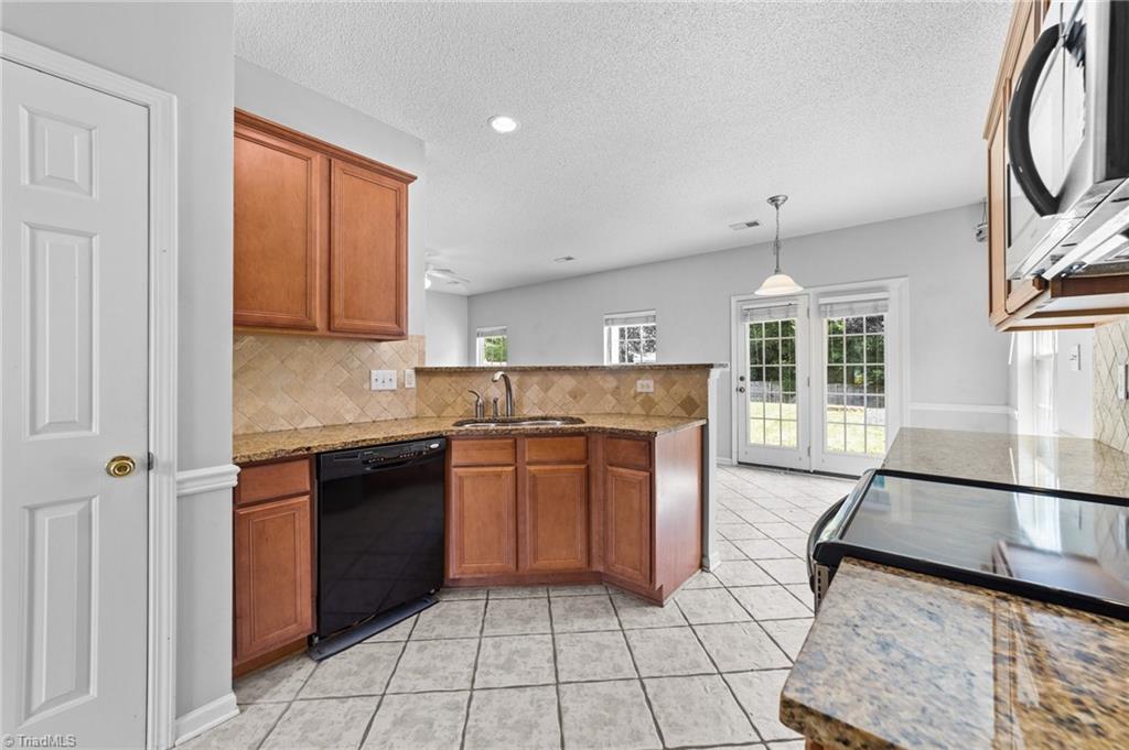 4712 Ridgefall Road Greensboro, NC 27410 - Photo 10 of 44 View of the kitchen and closet.
