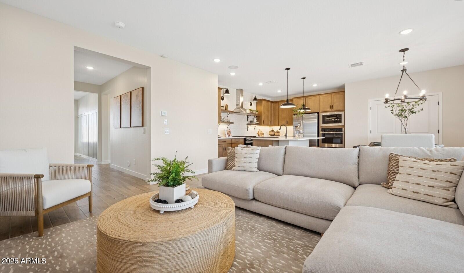 63 East Windsor Drive Gilbert, AZ 85296 - Photo 8 of 32 a living room with furniture kitchen and a chandelier