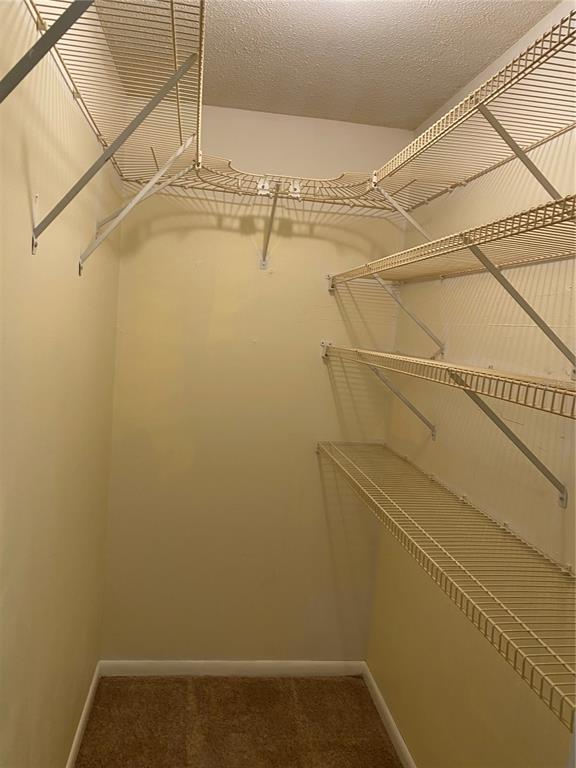 1500 Gay Road, Unit 17D Winter Park, FL 32789 - Photo 20 of 34 a view of a room with racks on the wall