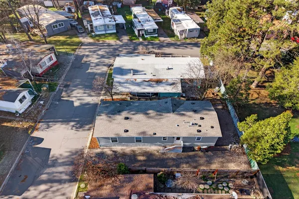 an aerial view of residential houses with outdoor space