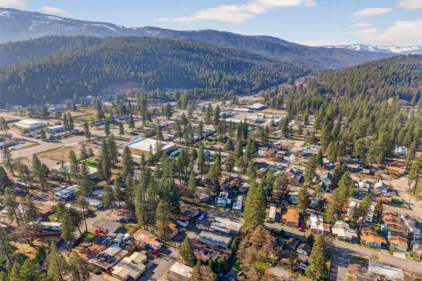 an aerial view of residential houses with outdoor space