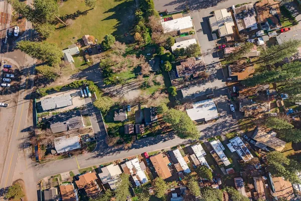 an aerial view of residential houses and outdoor space