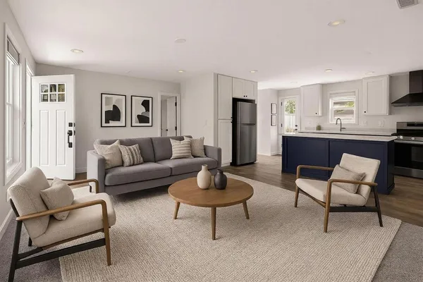 a view of kitchen with refrigerator stove and window