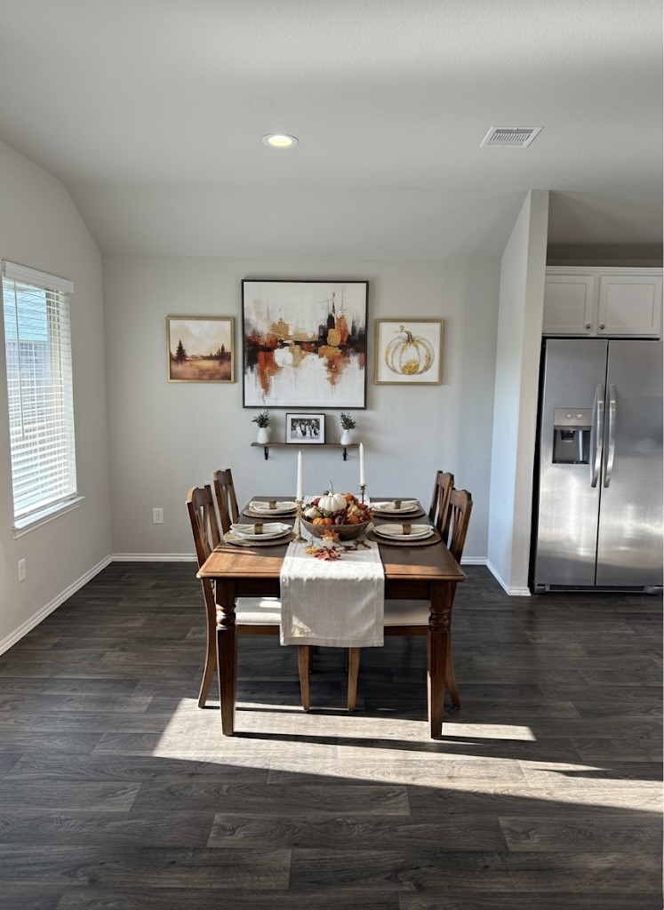 13917 Payette Arbor Court Conroe, TX 77384 - Photo 7 of 13 a dining room with furniture a chandelier and wooden floor