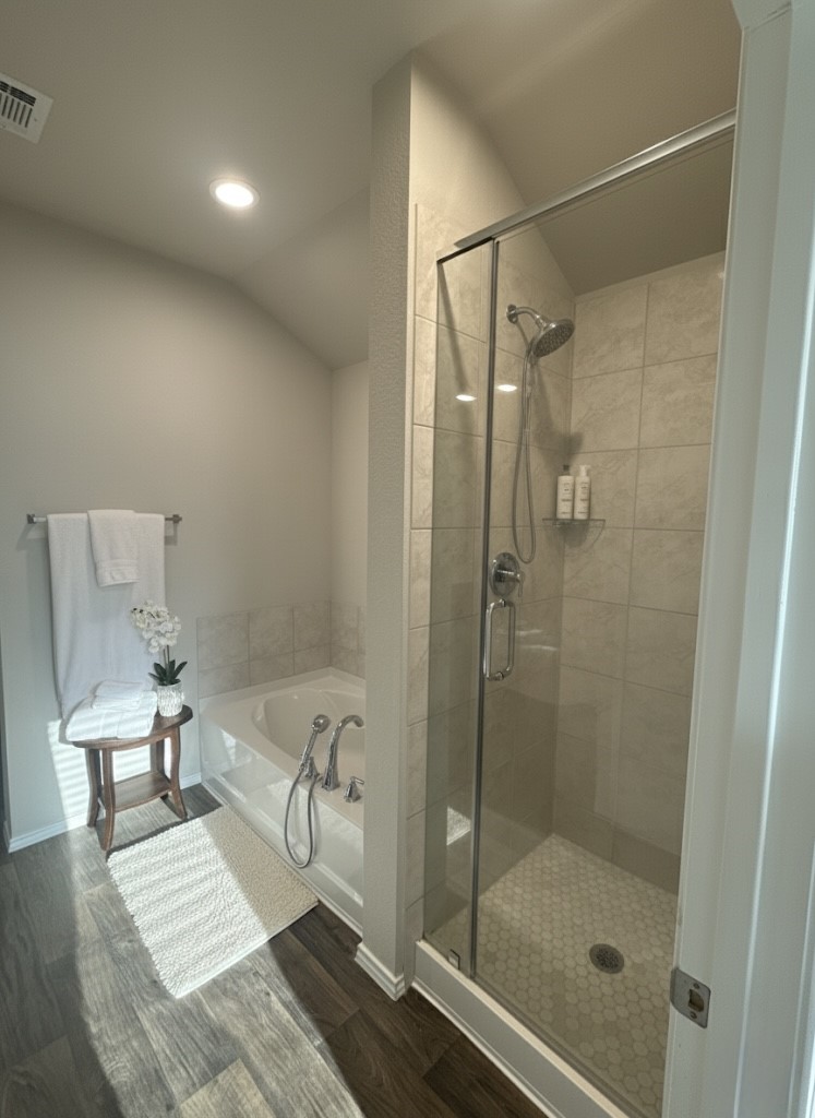 13917 Payette Arbor Court Conroe, TX 77384 - Photo 10 of 13 a bathroom with a shower a toilet and a window