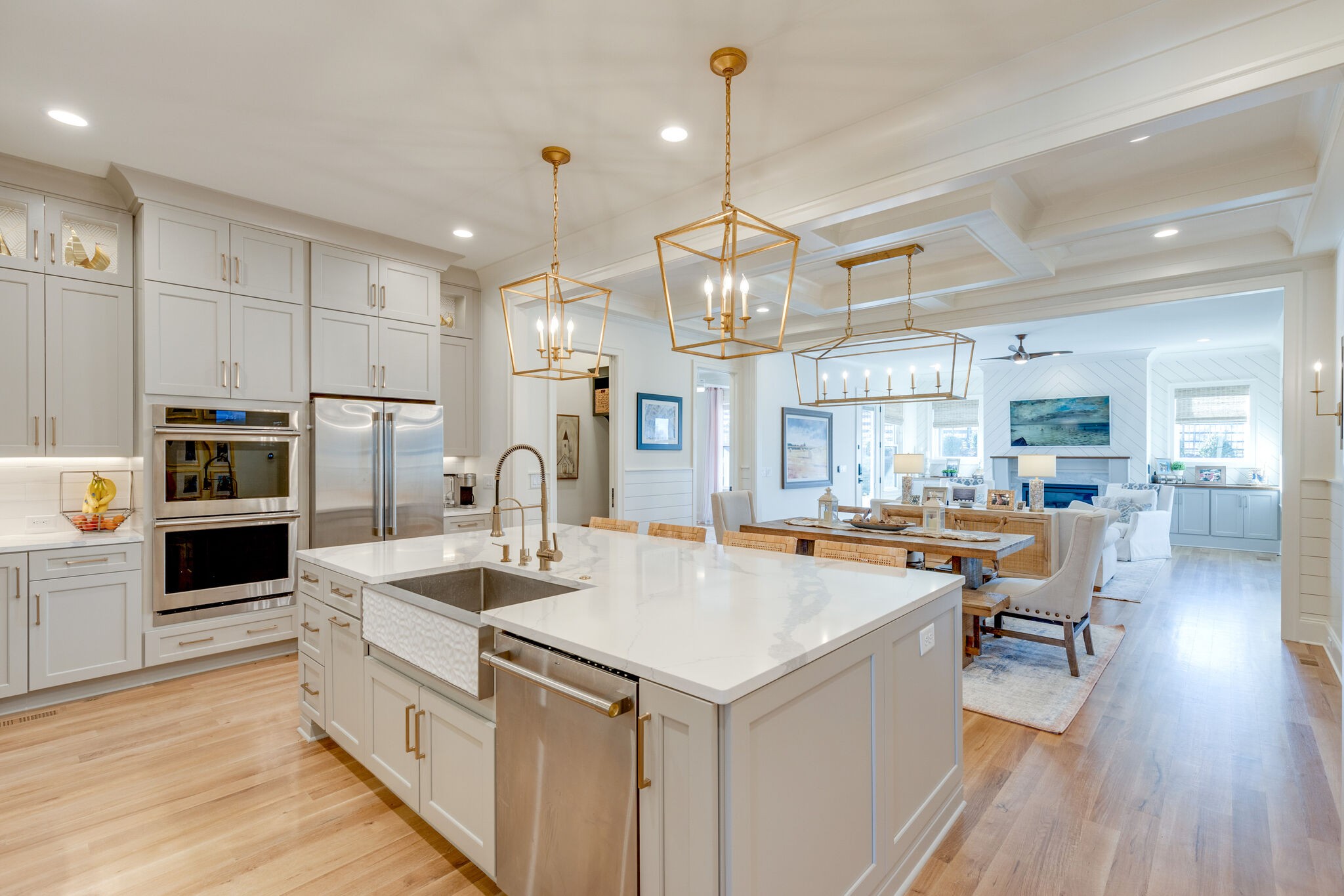 301 Circuit Road Franklin, TN 37064 - Photo 14 of 69 a large kitchen with kitchen island a stove a sink a refrigerator and a dining table with wooden floor