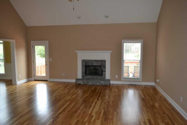 1628 Fair House Road Spring Hill, TN 37174 - Photo 3 of 9 The Living Room, with new Hardwood Flooring, to enhance the beauty of the Home.