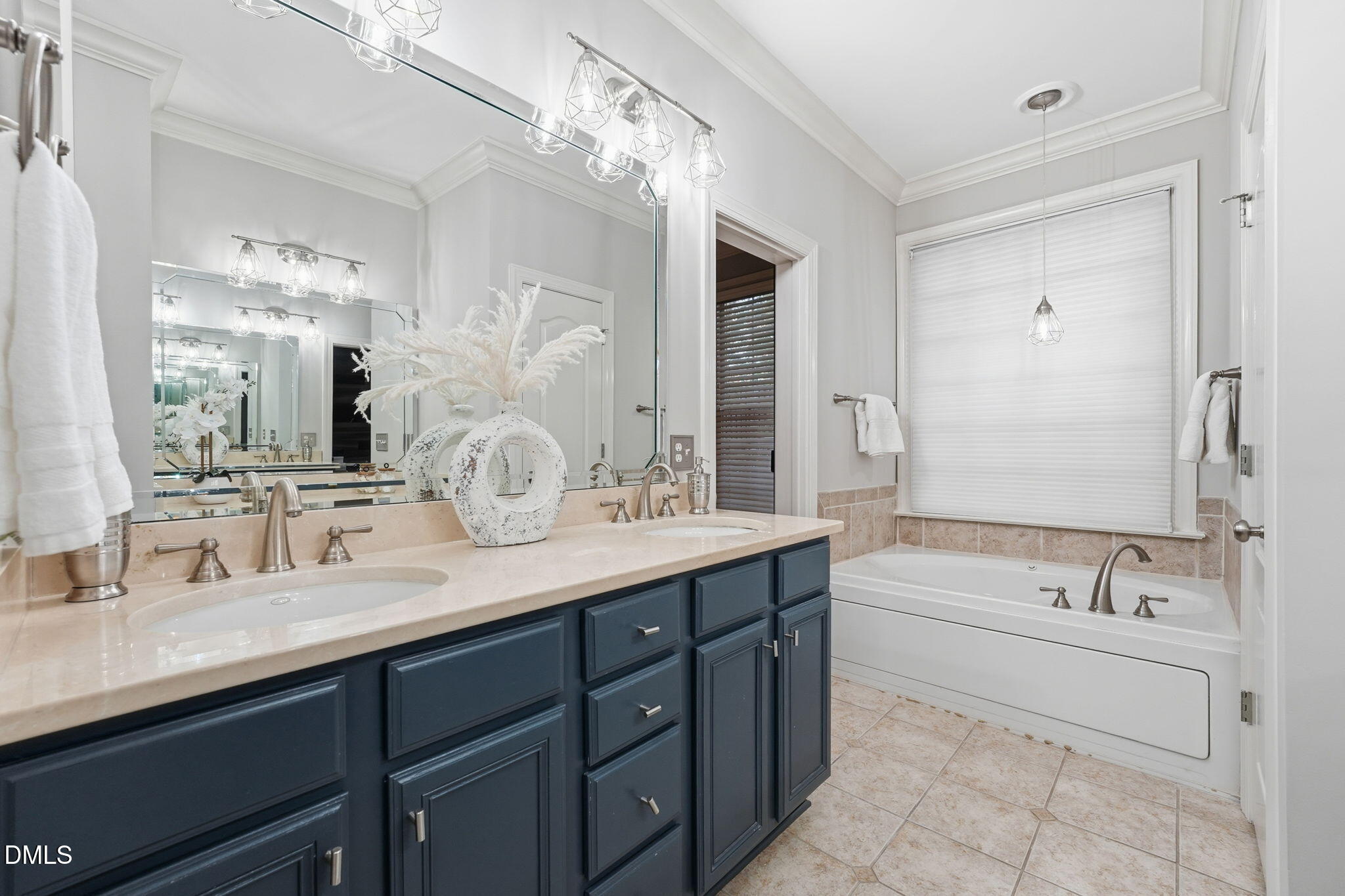 110 Bon Marche Lane Raleigh, NC 27615 - Photo 16 of 25 a bathroom with a sink double vanity granite tub and a mirror