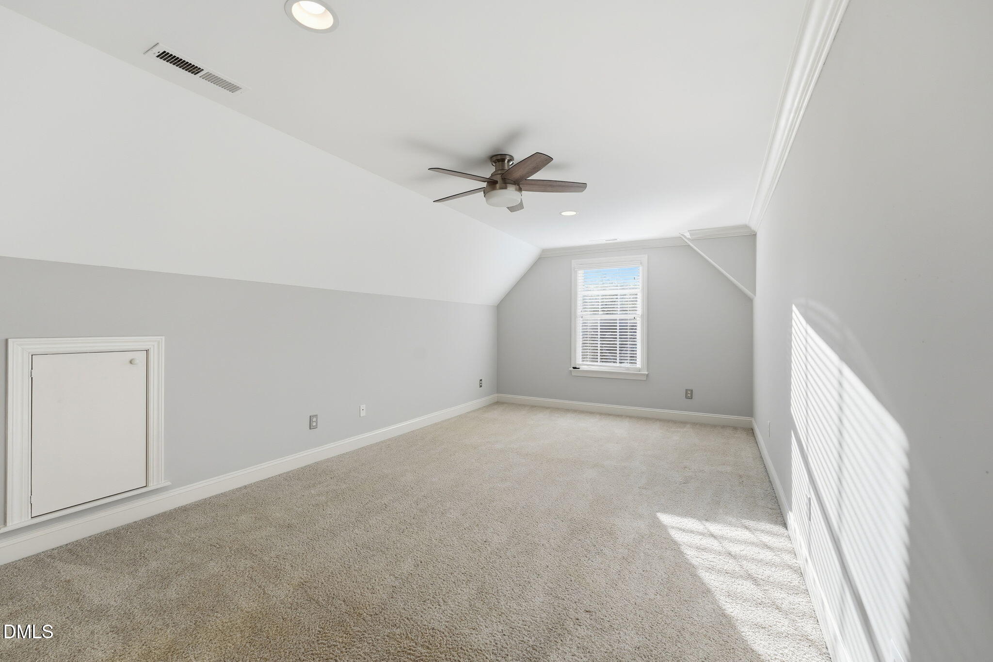 110 Bon Marche Lane Raleigh, NC 27615 - Photo 22 of 25 an empty room with a ceiling fan and a window