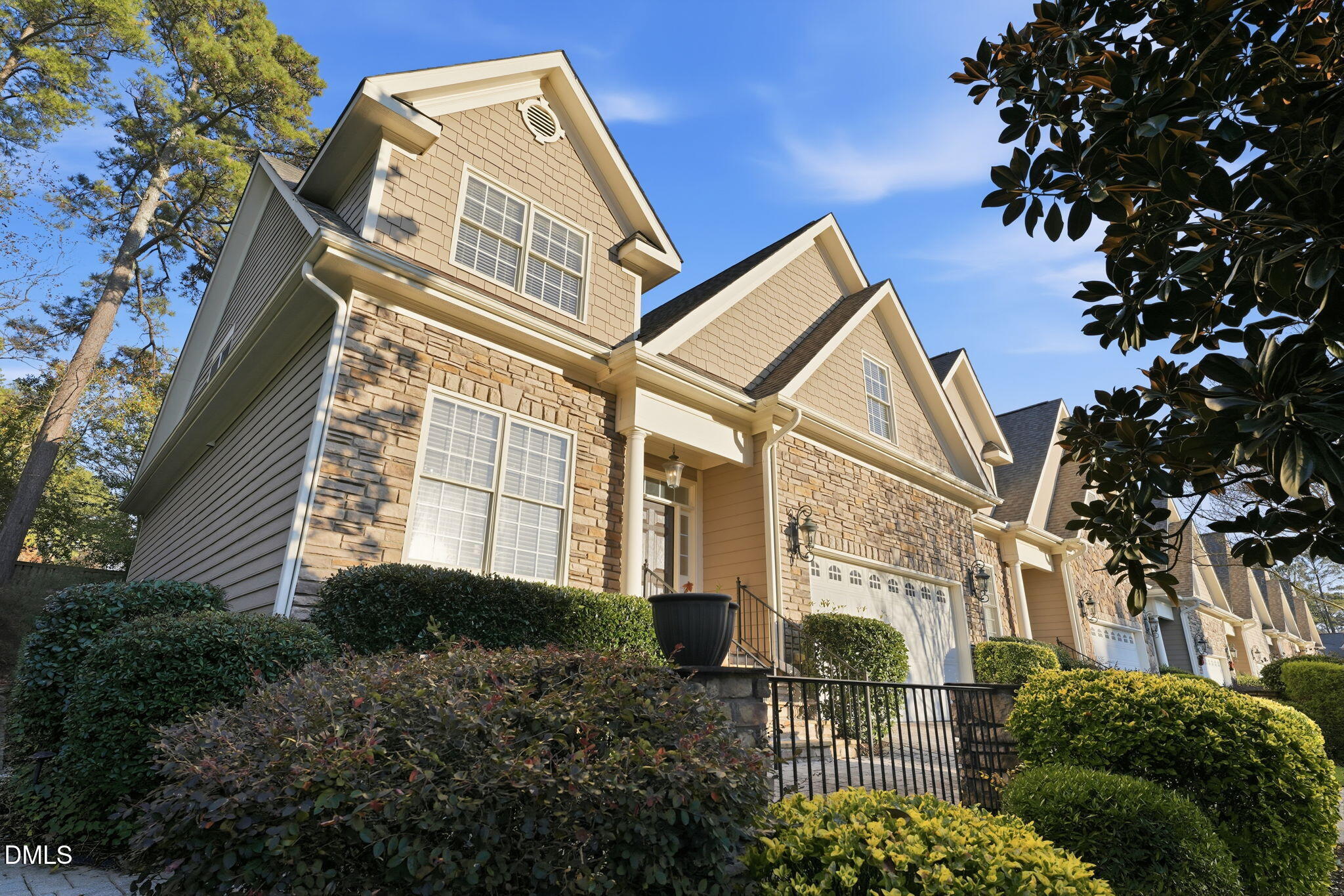 110 Bon Marche Lane Raleigh, NC 27615 - Photo 25 of 25 a view of a large building with a tree in front of it