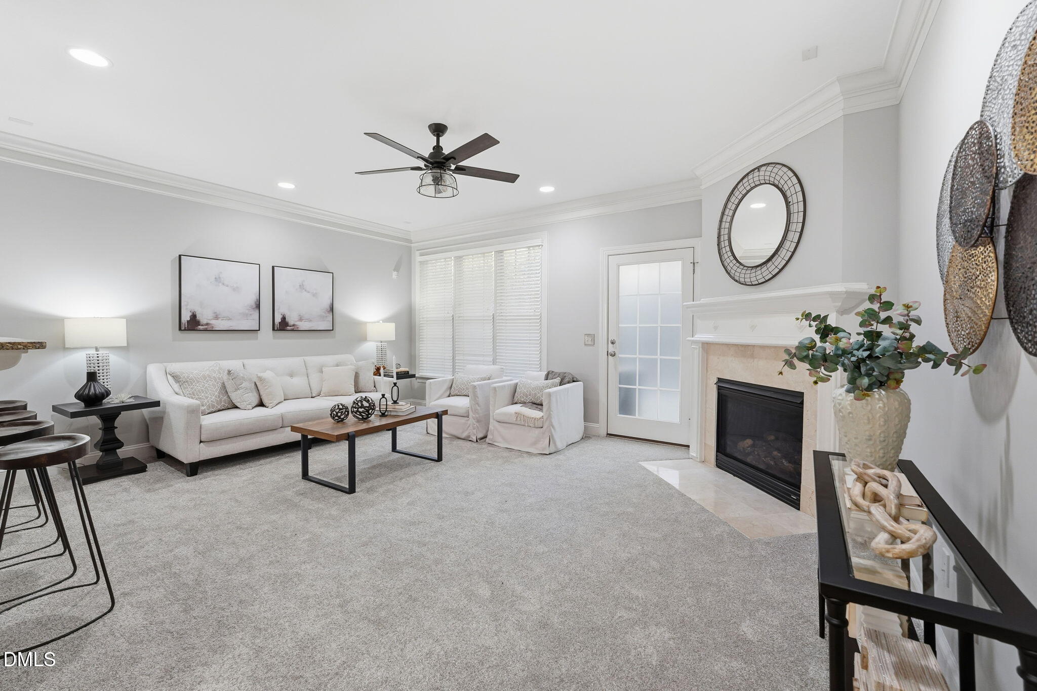 110 Bon Marche Lane Raleigh, NC 27615 - Photo 3 of 25 a living room with furniture a fireplace and a potted plant