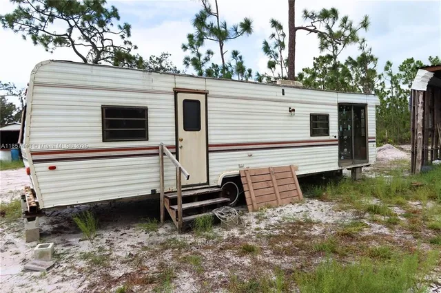 a view of a house with a yard and a balcony