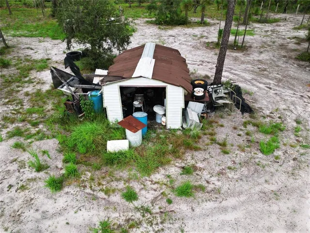 a view of a chairs and table in backyard