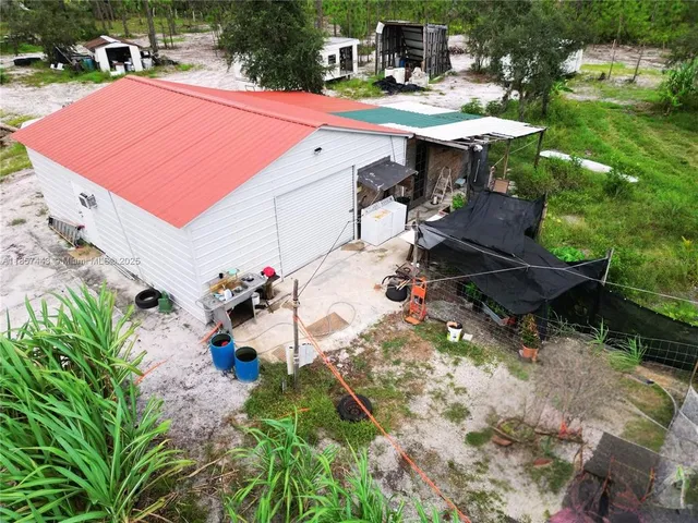 a view of a backyard with sitting area