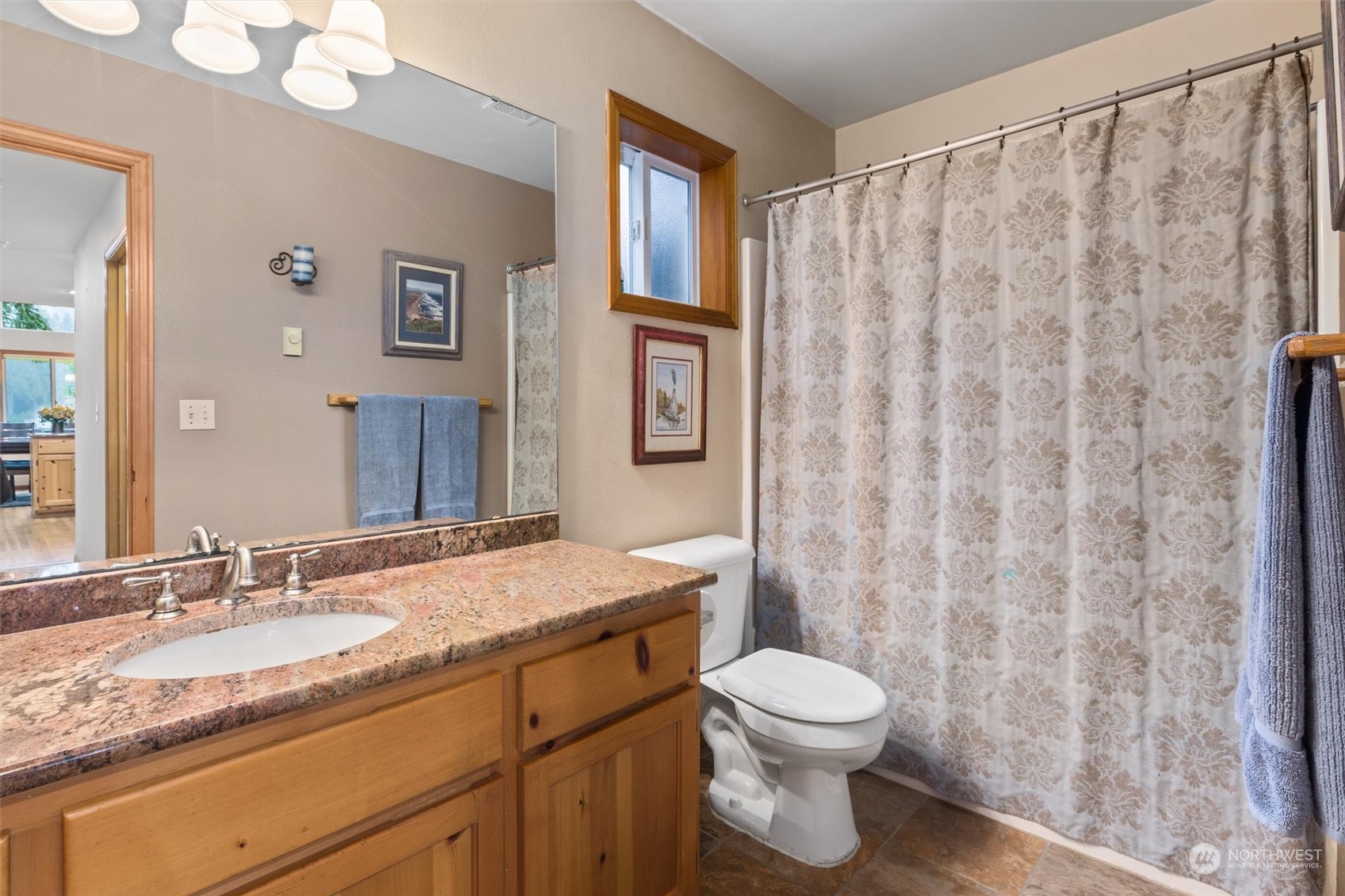 923 Southwest Lake Roesiger Road Snohomish, WA 98290 - Photo 13 of 40 a bathroom with a granite countertop bathtub sink vanity mirror and toilet