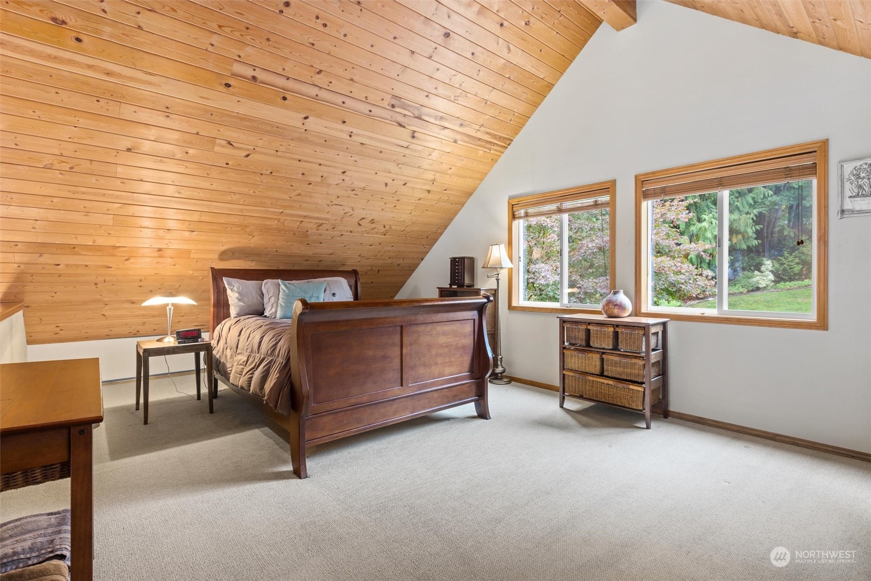 923 Southwest Lake Roesiger Road Snohomish, WA 98290 - Photo 17 of 40 a bedroom with furniture and a large window