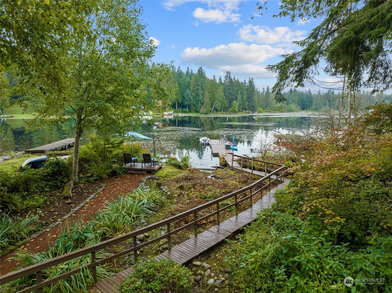 923 Southwest Lake Roesiger Road Snohomish, WA 98290 - Photo 2 of 40 a view of a lake with a house in the background