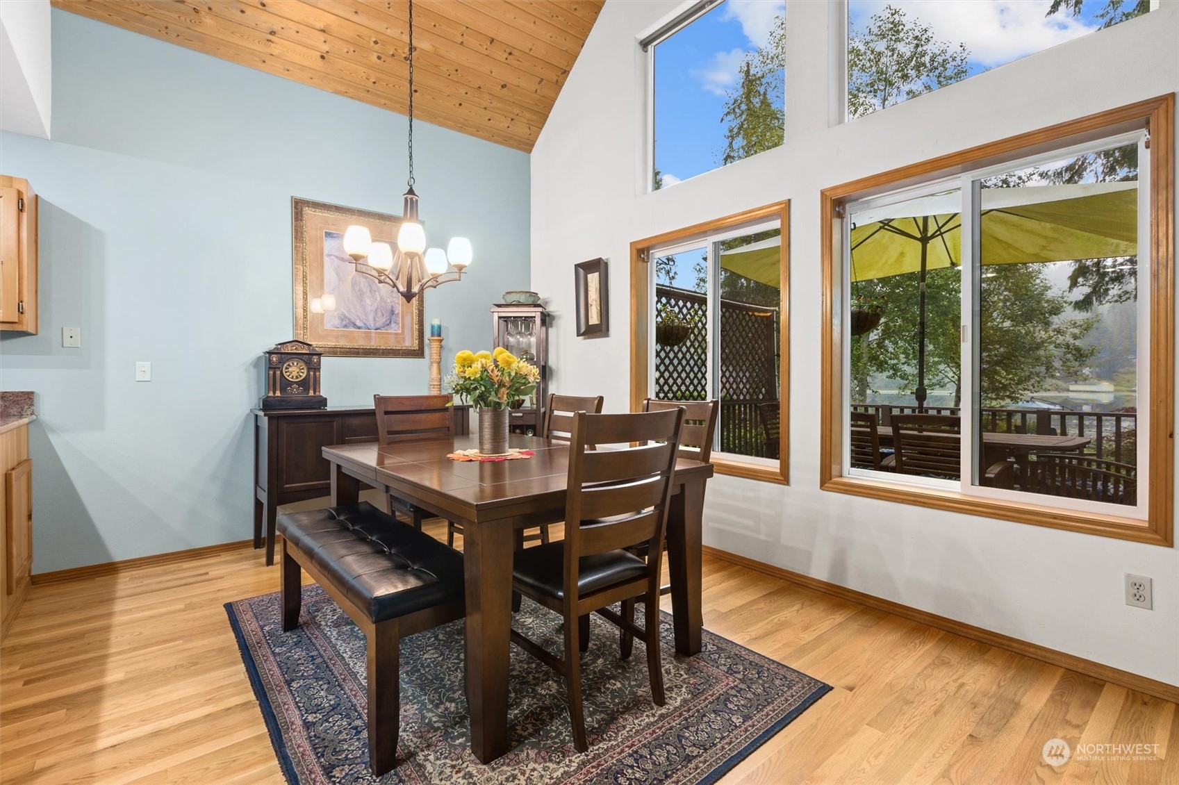 923 Southwest Lake Roesiger Road Snohomish, WA 98290 - Photo 8 of 40 a view of a dining room with furniture window and wooden floor