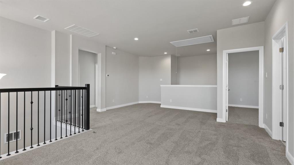 11409 Treehouse Trail Justin, TX 76247 - Photo 25 of 39 an empty room with staircase and entryway
