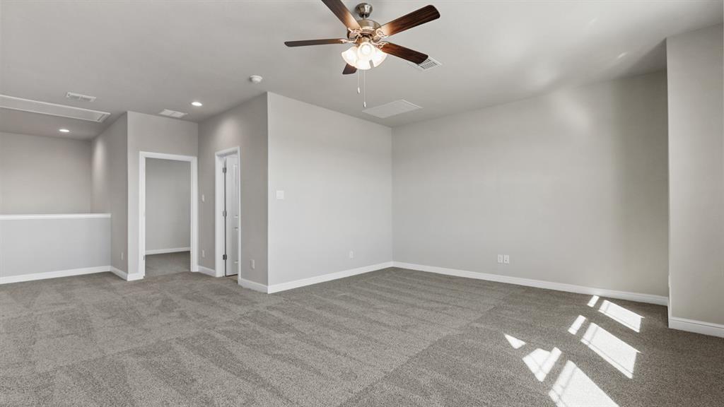 11409 Treehouse Trail Justin, TX 76247 - Photo 28 of 39 an empty room with closet and windows