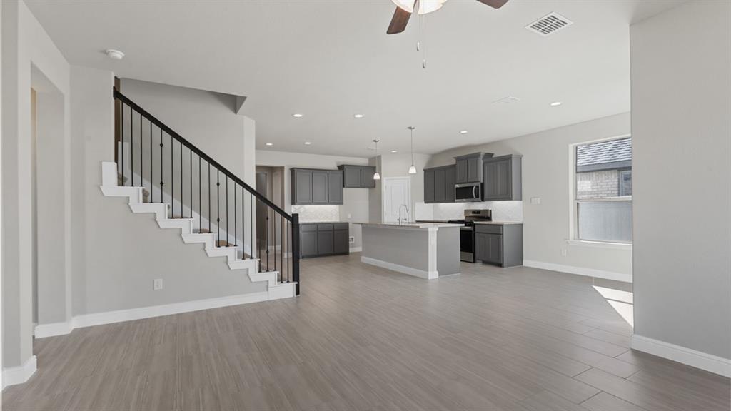 11409 Treehouse Trail Justin, TX 76247 - Photo 8 of 39 a view of kitchen with wooden floor and electronic appliances