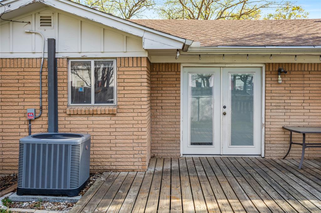 8712 Guadalupe Road Fort Worth, TX 76116 - Photo 22 of 25 a view of a brick house with wooden floor