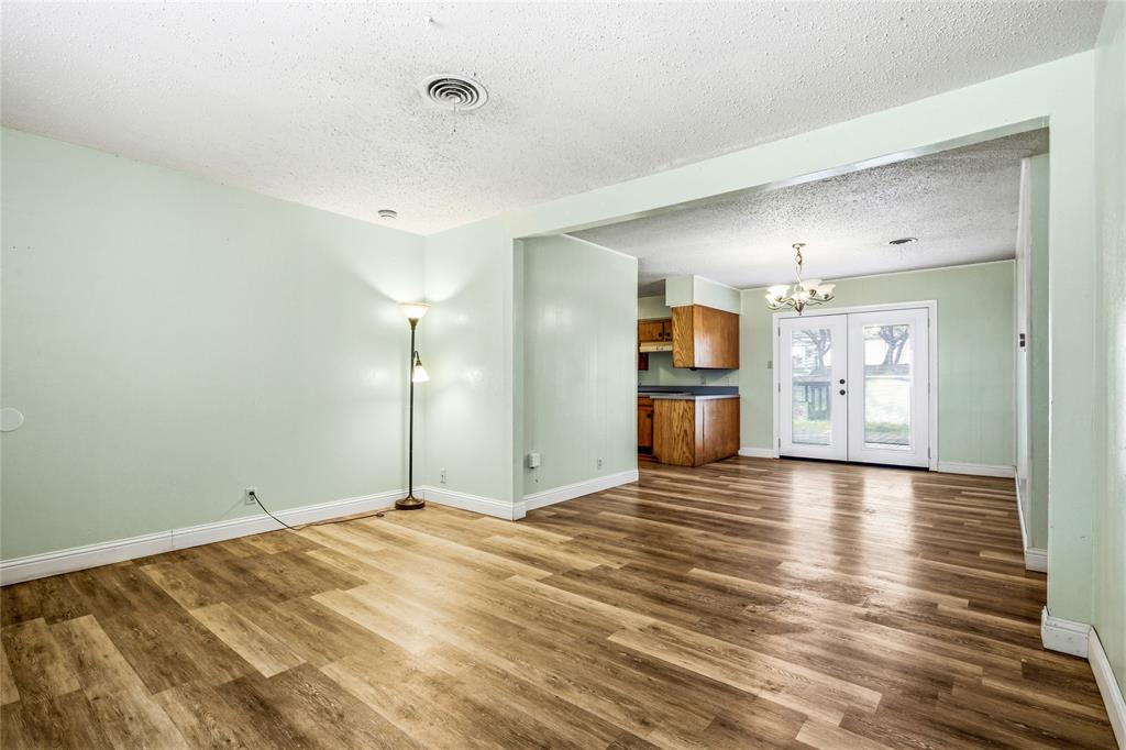 8712 Guadalupe Road Fort Worth, TX 76116 - Photo 6 of 25 a view of empty room with wooden floor