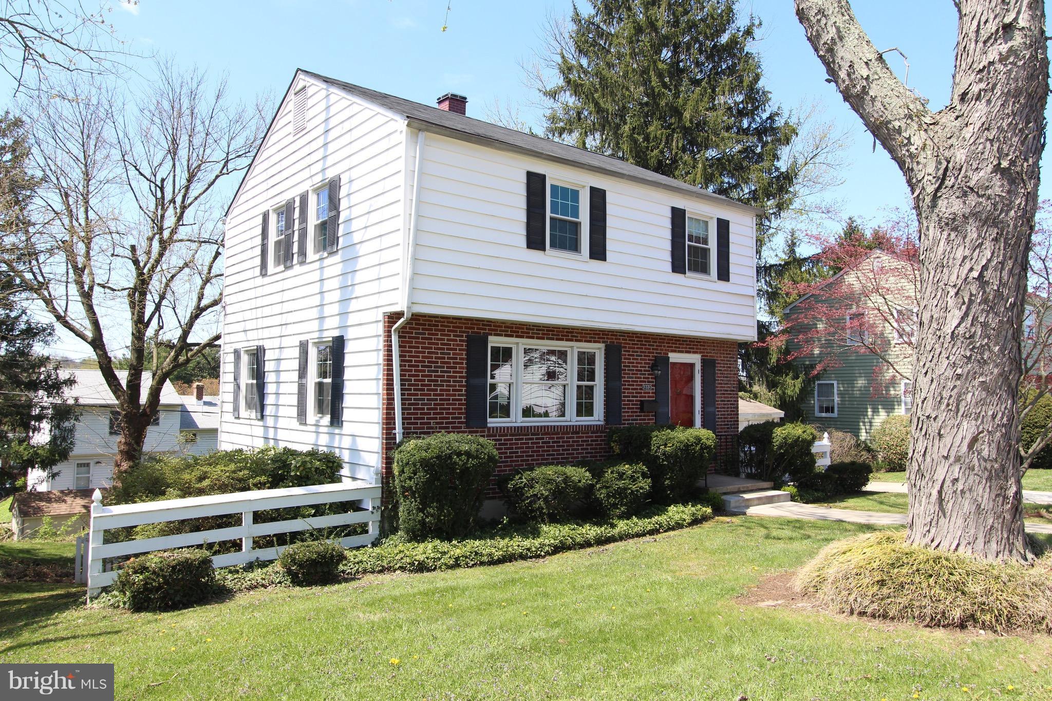 1202 Longford Road Lutherville-Timonium, MD 21093 - Photo 2 of 20 a front view of a house with a yard