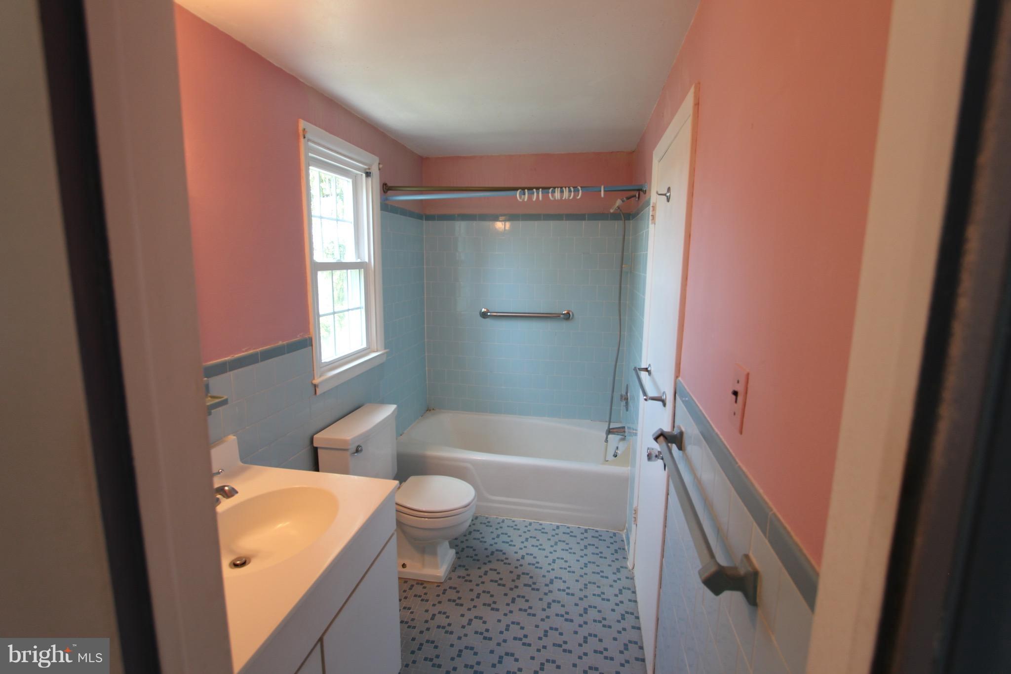 1202 Longford Road Lutherville-Timonium, MD 21093 - Photo 11 of 20 a bathroom with a granite countertop sink toilet and shower