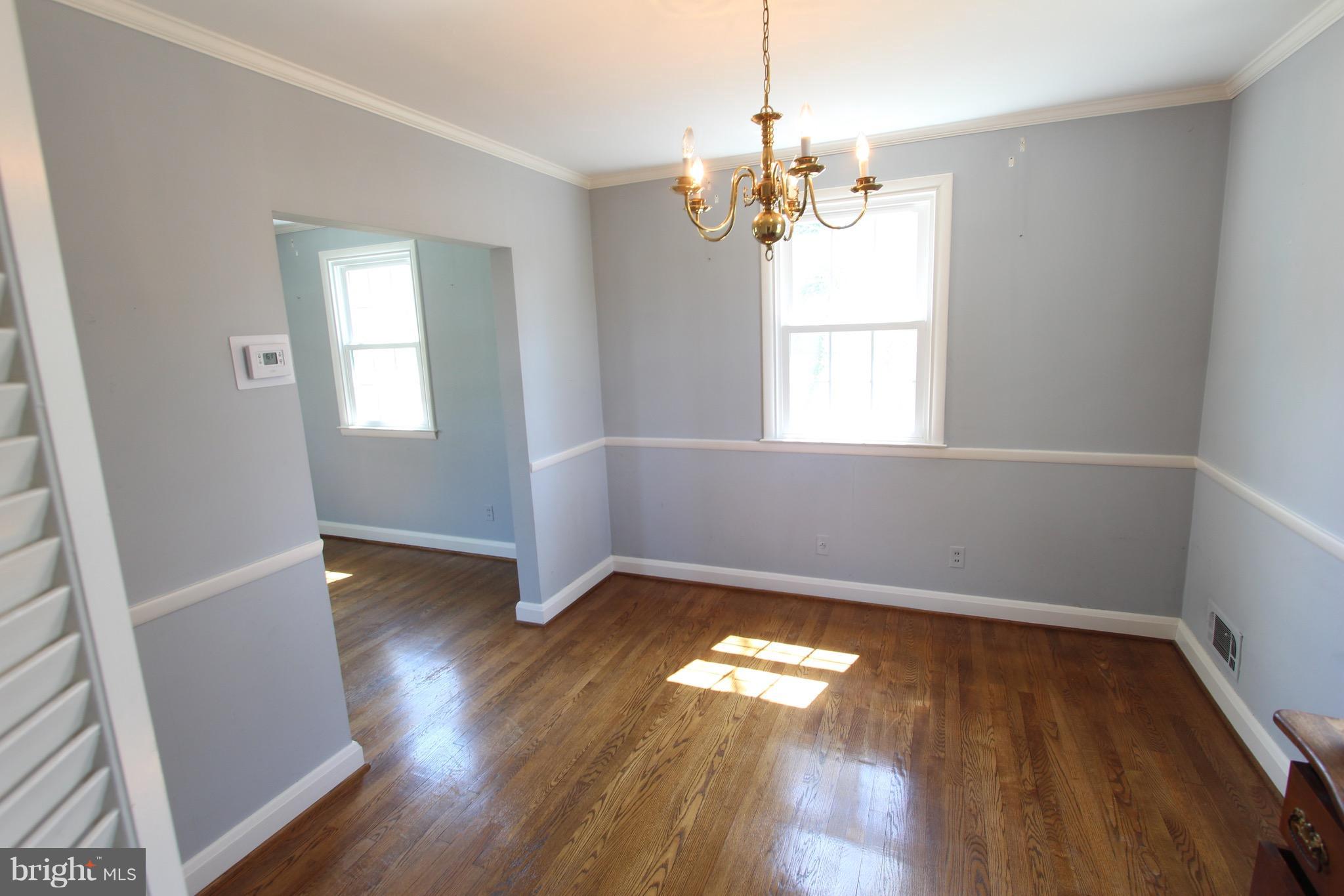 1202 Longford Road Lutherville-Timonium, MD 21093 - Photo 6 of 20 a view of empty room with wooden floor and fan