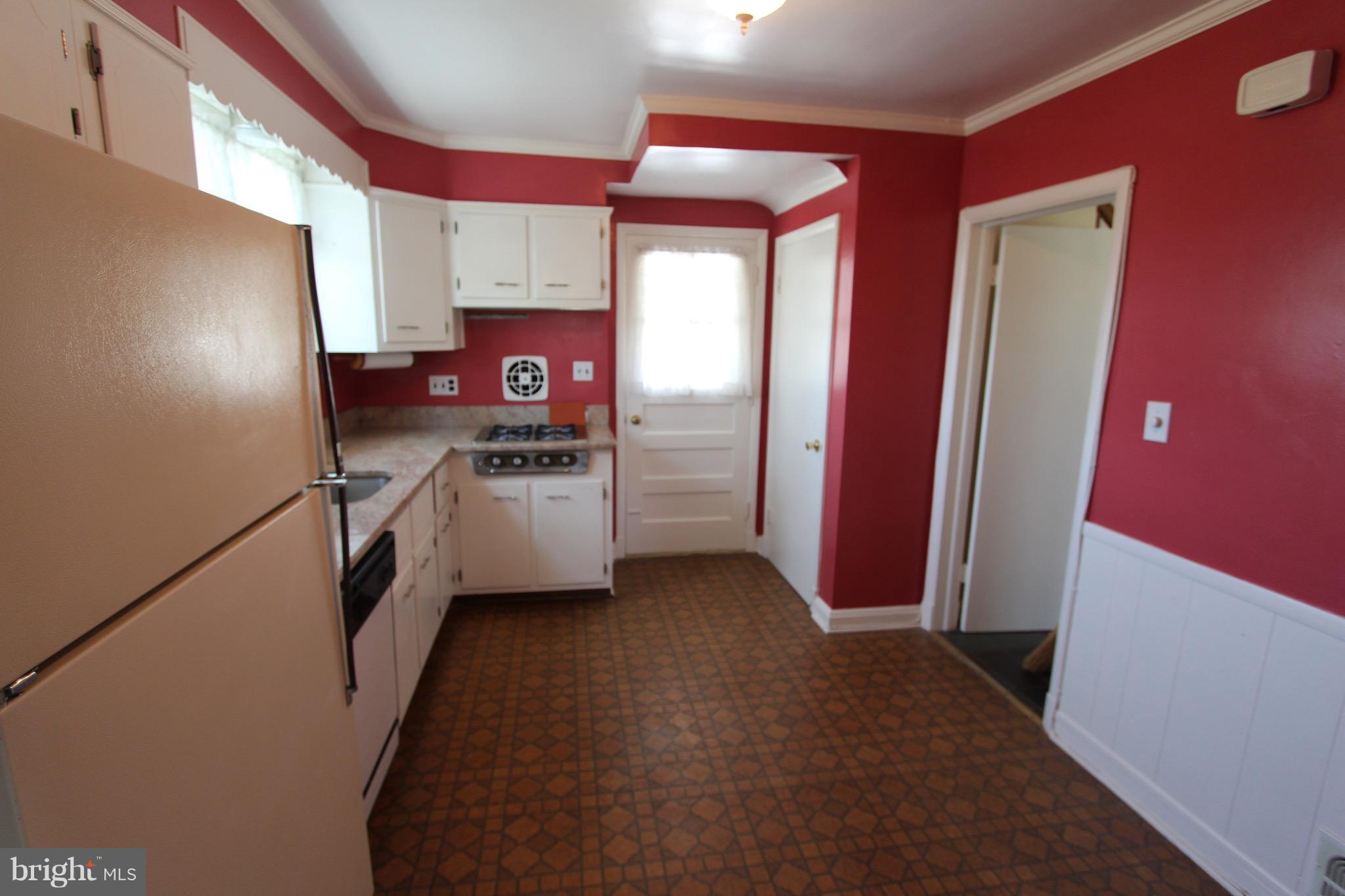 1202 Longford Road Lutherville-Timonium, MD 21093 - Photo 7 of 20 a kitchen with stainless steel appliances a refrigerator and a stove