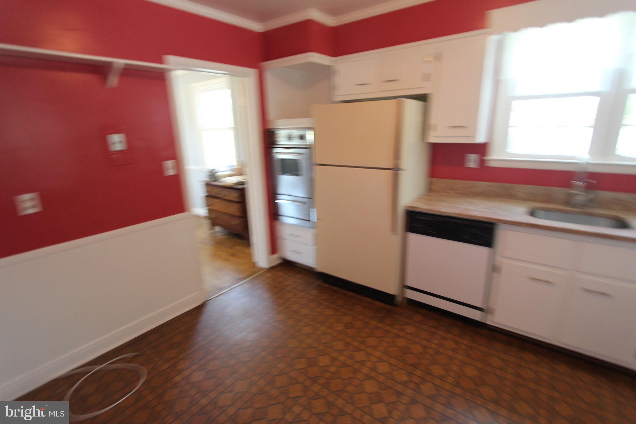 1202 Longford Road Lutherville-Timonium, MD 21093 - Photo 9 of 20 a kitchen with a refrigerator and window