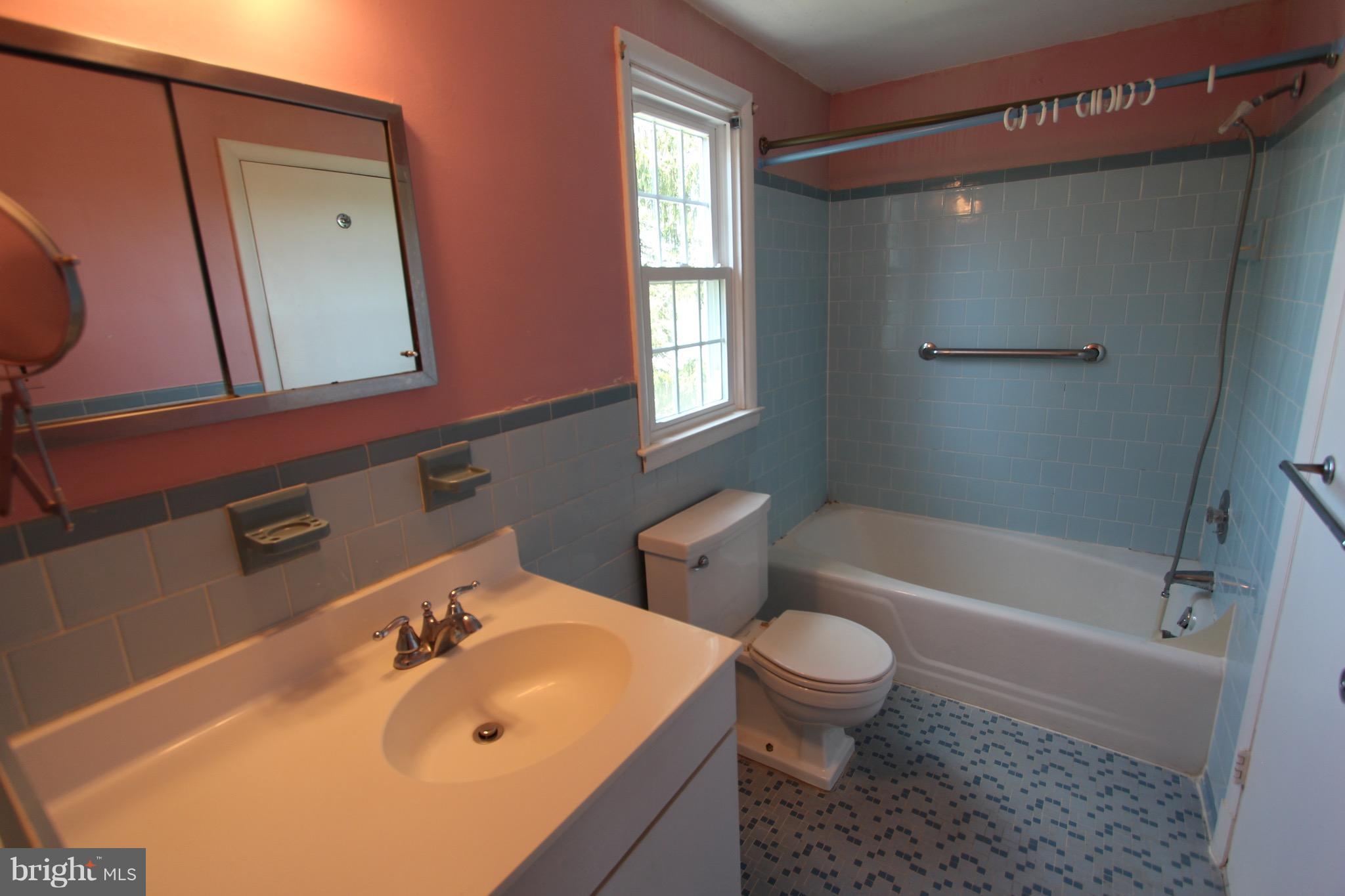 1202 Longford Road Lutherville-Timonium, MD 21093 - Photo 10 of 20 a bathroom with a sink a toilet and bathtub